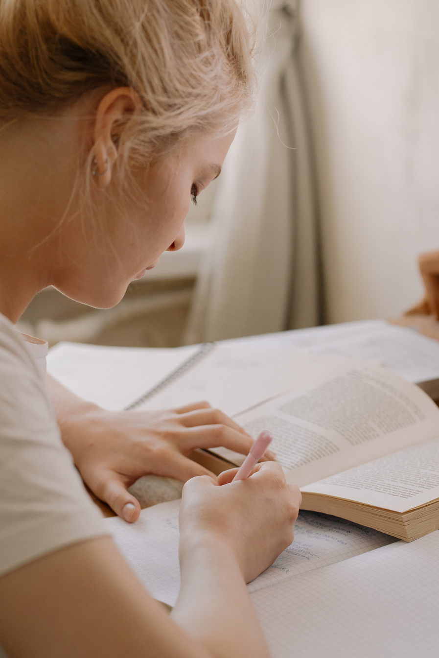 Girl in White Shirt Reading Book